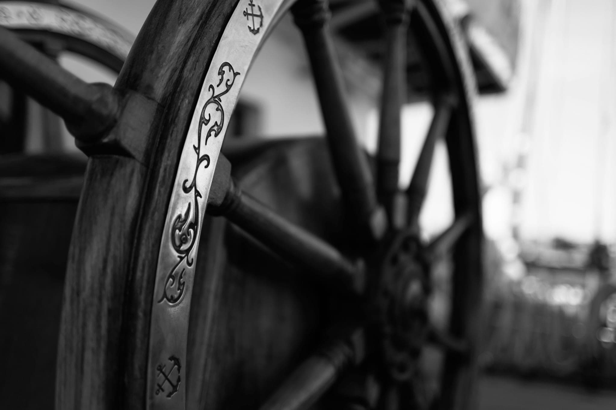 Close-up of the rim of a wooden ship's wheel