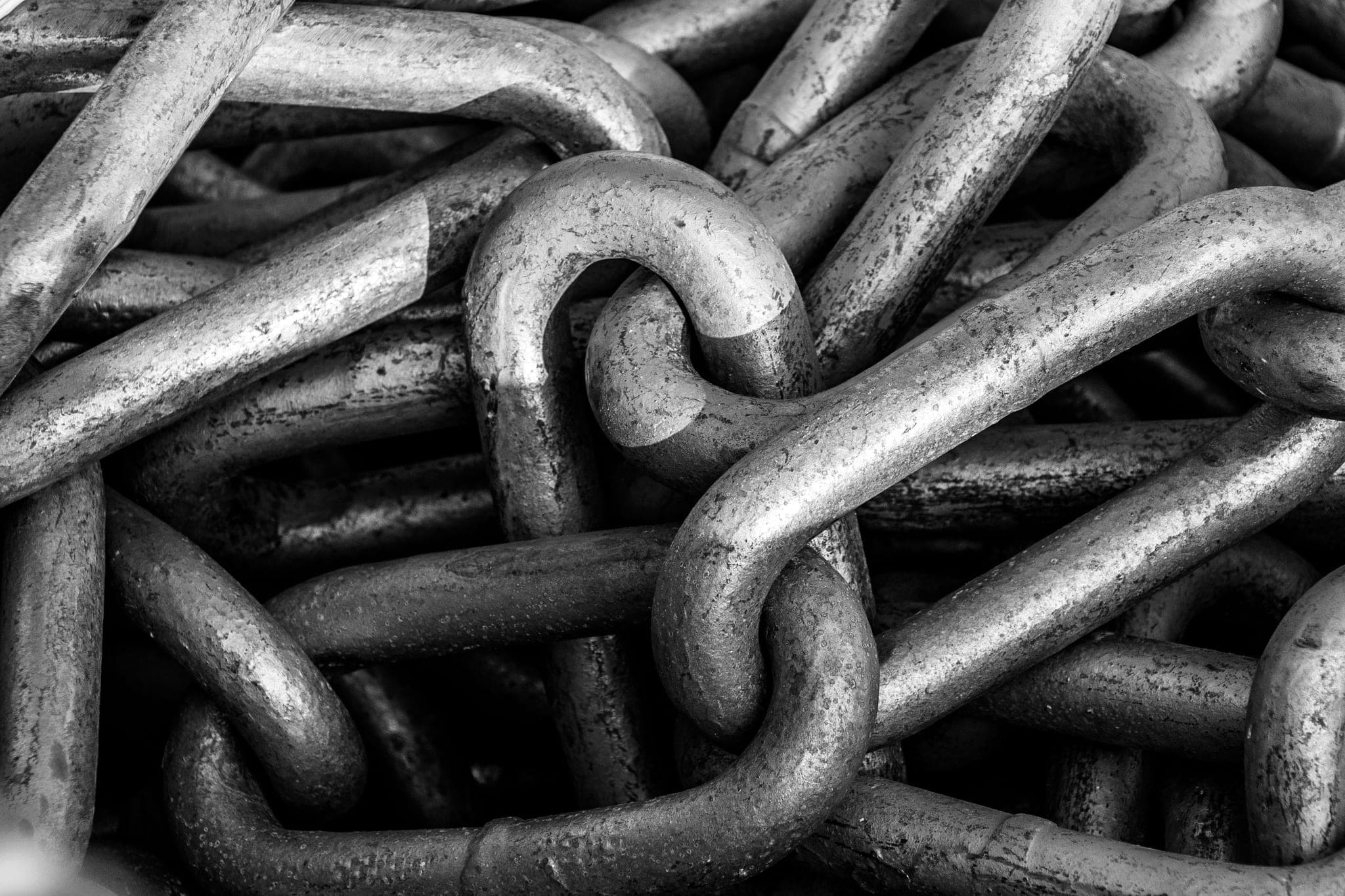 Close-up of interlocking industrial steel chain links