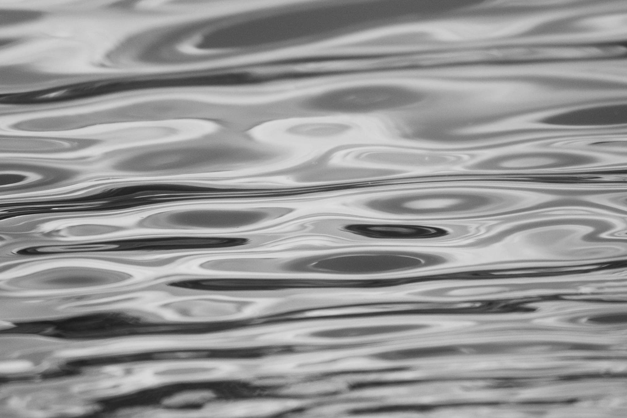Ripples spreading across a still water surface