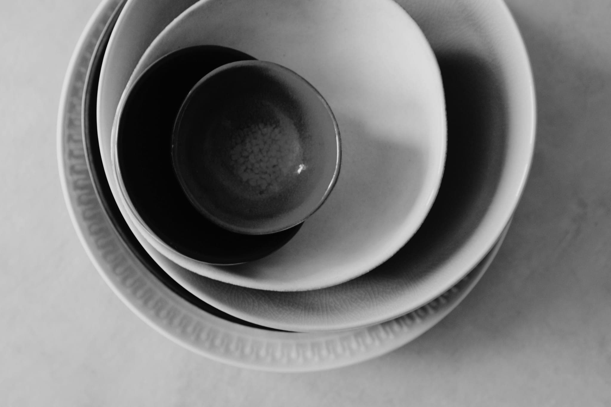 Four bowls of different sizes nested inside one another, seen from above