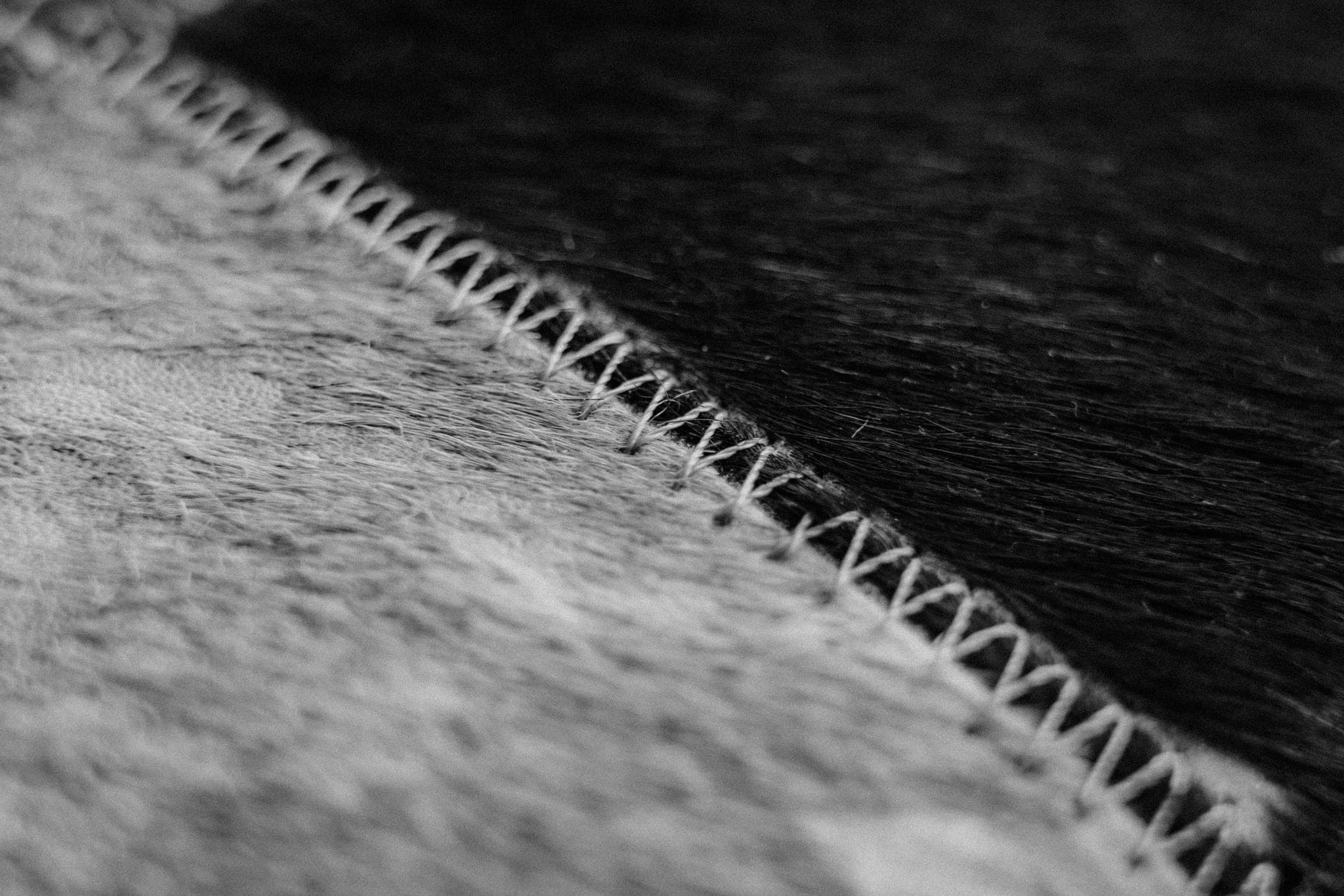 A line of stitching running across two joined pieces of fabric
